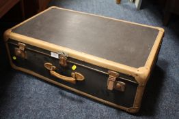 A VINTAGE BANDED SUITCASE