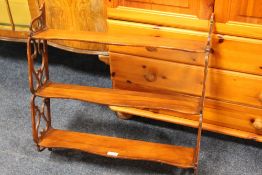 A SMALL SET OF FRETWORK HANGING SHELVES W-62CM