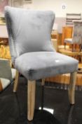 A MODERN UPHOLSTERED STUDDED BEDROOM CHAIR