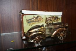 A BOXED VINTAGE MUSICAL CAR ORNAMENT