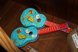 TWO VINTAGE TIN PLATE CHAD VALLEY GUITAR TOYS