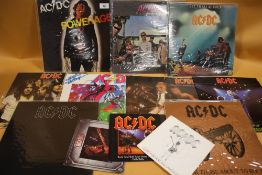 A COLLECTION OF ACDC LP RECORDS AND SINGLES TO INCLUDE BACK IN BLACK, HIGH VOLTAGE, LET THERE BE