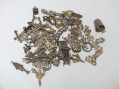 AN VINTAGE CHARM BRACELET COMPRISING APPROX 61 CHARMS