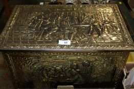 A METAL COATED COAL BOX EMBOSSED WITH FIGURATIVE DETAIL