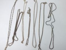 EIGHT LARGE SILVER CHAINS