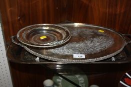 A SILVER PLATED TWIN HANDLED SERVING TRAY TOGETHER WITH TWO OTHERS