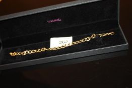 A 9 CARAT GOLD CURB LINK BRACELET WEIGHT - 4.1G APPROX