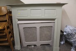 A PAINTED FIRE SURROUND AND TWO RADIATOR COVERS (3)