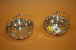 A PAIR OF WMF CIRCULAR SILVER PLATED BASKETS, with openwork and Greek key design border, basket Dia
