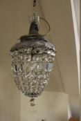 A GLASS CRYSTAL LUSTRE CEILING LIGHT WITH MOUNTING ROSE. having various cut glass droppers forming a