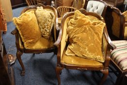 A PAIR OF WALNUT UPHOLSTERED TUB STYLE ARMCHAIRS (2)