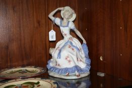 A LARGE NAO SEATED FEMALE FIGURINE, H 29 cm