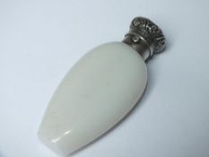 A SILVER MOUNTED OPAQUE GLASS PERFUME BOTTLED MARKED 