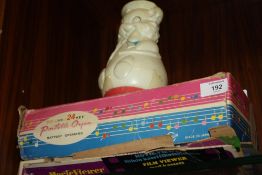 A BOXED CHILDRENS PORTABLE ORGAN TOGETHER WITH A DISNEY MOVIE VIEWER AND A VINTAGE WEIGHTED TOY