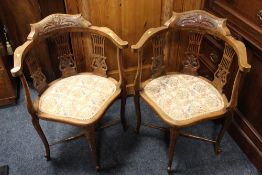 A PAIR OF ANTIQUE CARVED MAHOGANY CORNER CHAIRS