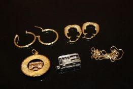 A YELLOW METAL TRAM PENDANT STAMPED 14K TOGETHER WITH A WHITE METAL EXAMPLE AND A 9 CARAT GOLD