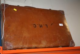 A VINTAGE LEATHER SUITCASE