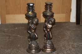 A PAIR OF LARGE COPPER EFFECT FIGURATIVE CANDLESTICKS