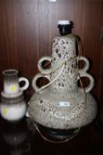 A LARGE WEST GERMAN STYLE TABLE LAMP, TOGETHER WITH A SIMILAR HANDLED VASE (2)