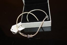 A SILVER PANDORA NECKLACE WITH CHARMS