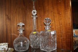 THREE PRESSED GLASS DECANTERS