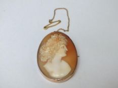 A LARGE VICTORIAN 9CT GOLD MOUNTED CAMEO BROOCH