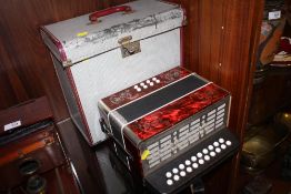 A CASED VINTAGE ACCORDION