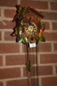 A VINTAGE WOODEN CUCKOO CLOCK & WEIGHTS