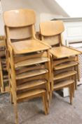 A COLLECTION OF NINE RETRO STACKING CHAIRS