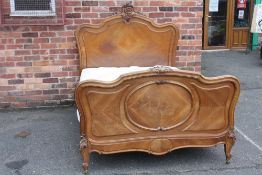 AN ANTIQUE 19TH CENTURY FRENCH WALNUT BED FRAME, with typical Rococo carved detail, with mattress, W