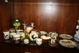 A LARGE QUANTITY OF GLAZED DEVON WARE TO INCLUDE A TWIN HANDLED VASE, TEAPOT, TABLE VESTA'S ETC (