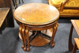A WALNUT ART DECO STYLE NEST OF FIVE TABLES DIA. CM