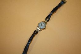 A VINTAGE HALLMARKED 9 CARAT GOLD CASED LADIES WRISTWATCH