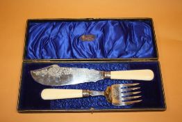 A CASED SET OF ANTIQUE FISH SERVERS