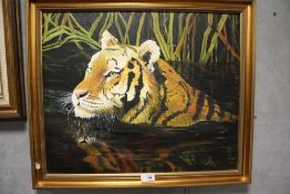 A GILT FRAMED OIL ON BOARD DEPICTING A SWIMMING TIGER SIGNED MEGAN EMMERSON