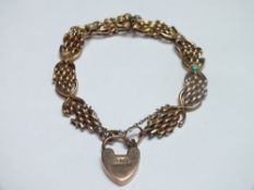 A 9CT GOLD DECORATIVE PANEL LINK STYLE BRACELET, the links joined together with fixed panels set