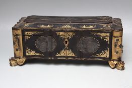 A DECORATIVE CHINESE LACQUER WARE JEWELLERY BOX, of ornate rectangular form raised on outswept '