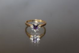 A HALLMARKED 18 CARAT GOLD AMETHYST RING, approx weight 2.3g, ring size L