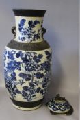 A LARGE ORIENTAL CRACKLE GLAZE BALUSTER TEMPLE VASE AND COVER WITH CHARACTER MARK TO BASE, the