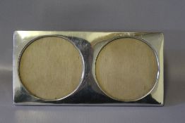 A CONTINENTAL SILVER DOUBLE PHOTO FRAME, W 20.75 cm