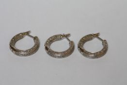 THREE HINGED HOOP 18CT WHITE GOLD DIAMOND SET EARRINGS, weight 16.7 gms - one stone missing