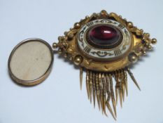 A VICTORIAN TYPE MOURNING BROOCH, with central cabochon stone and white enamel detail, removable