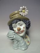 A LLADRO BUST OF A CLOWN, clasped hands to side of face, H 28.5 cm