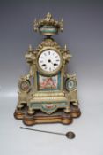 A 19TH CENTURY GILT METAL AND PORCELAIN FRENCH MANTEL CLOCK, of classical outline with urn finial,