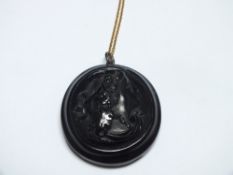 A JET CAMEO PENDANT ON 9CT GOLD CHAIN, W 4 cm