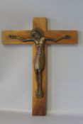 A BRONZE CORPUS CHRISTI, mounted on wooden cross, monogrammed, H 30.25 cm