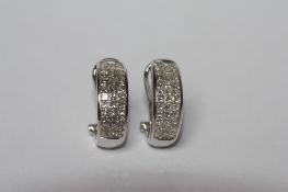 A PAIR OF 18CT WHITE GOLD AND DIAMOND HALF HOOP EARRINGS, with three rows of princess cut