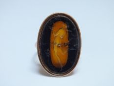 A CAVED OVAL INTAGLIO RING, D 2.5 cm, rig size O