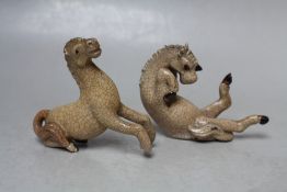 TWO UNUSUAL MINIATURE CRACKLE GLAZE TANG HORSES, one modelled seated with hooves flailing, the other