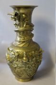 A WELL CAST ORIENTAL BRASS BALUSTER VASE BEARING SIX CHARACTER MARK TO THE BASE, the body with three